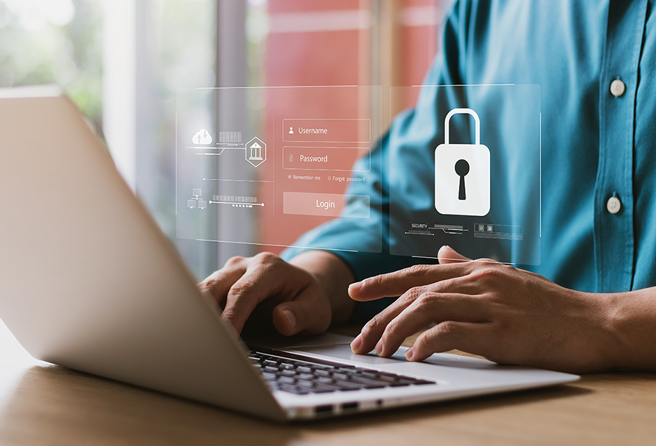 Tax professional using a laptop with a security lock screen, illustrating practical WISP safeguards for protecting client data.