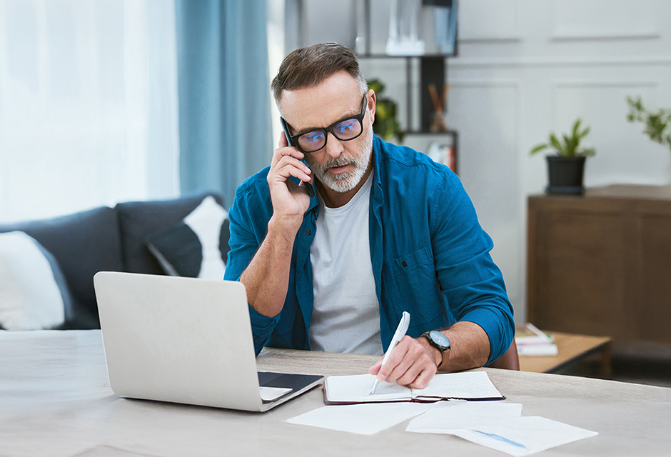 Tax professional reviewing client financial records for accurate entity tax return reporting