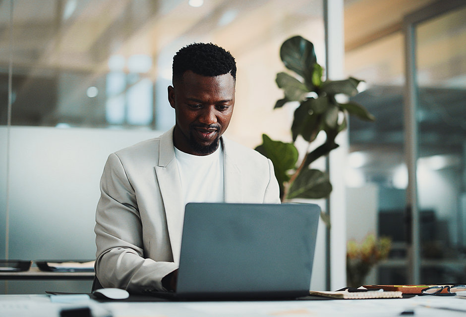 Tax professional reviewing qualified overtime compensation reporting on a laptop