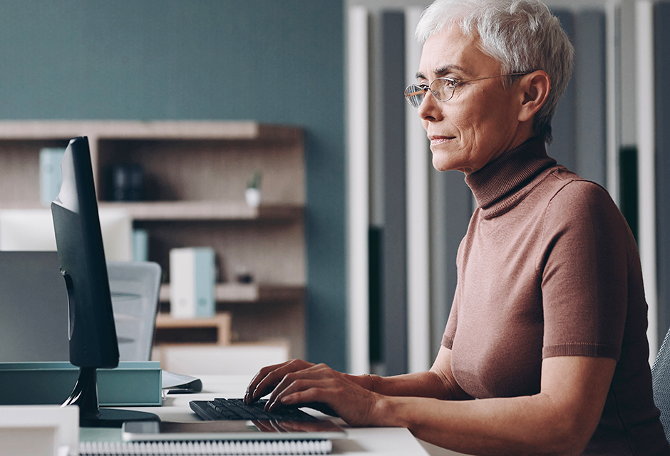 Tax professional reviewing IRS transcript options on a desktop computer.