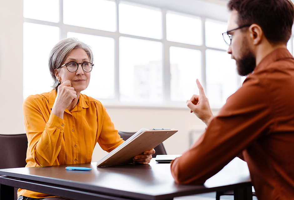 A tax professional discusses partnership liquidation tax issues with a client