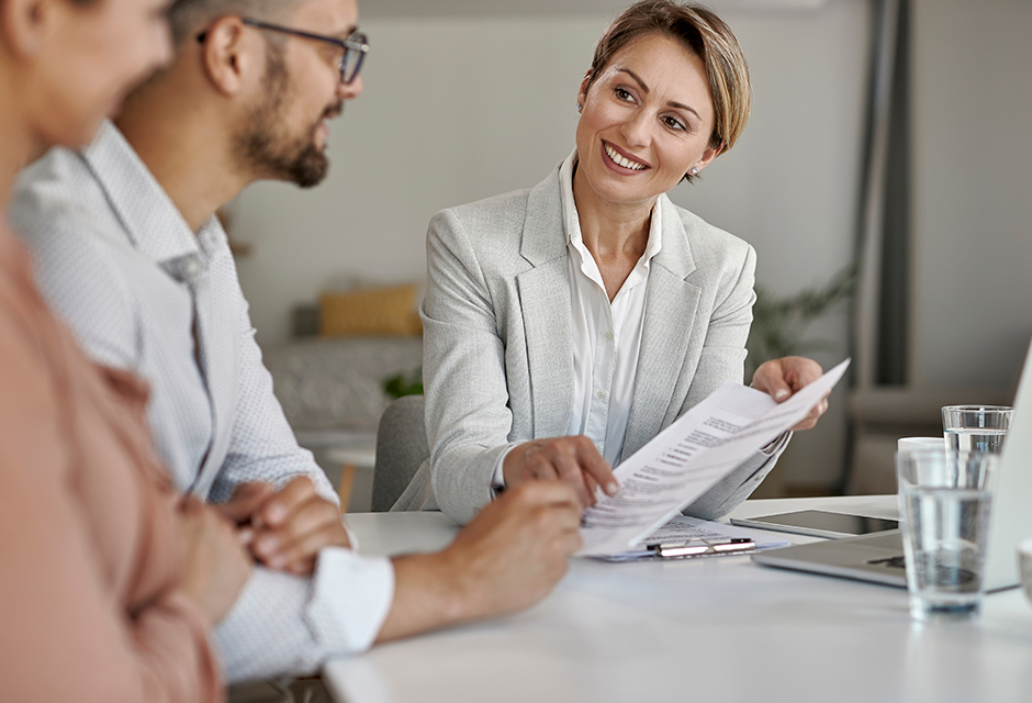 A tax professional reviews employer contribution rules with business clients while guiding them through written-plan and reporting requirements.