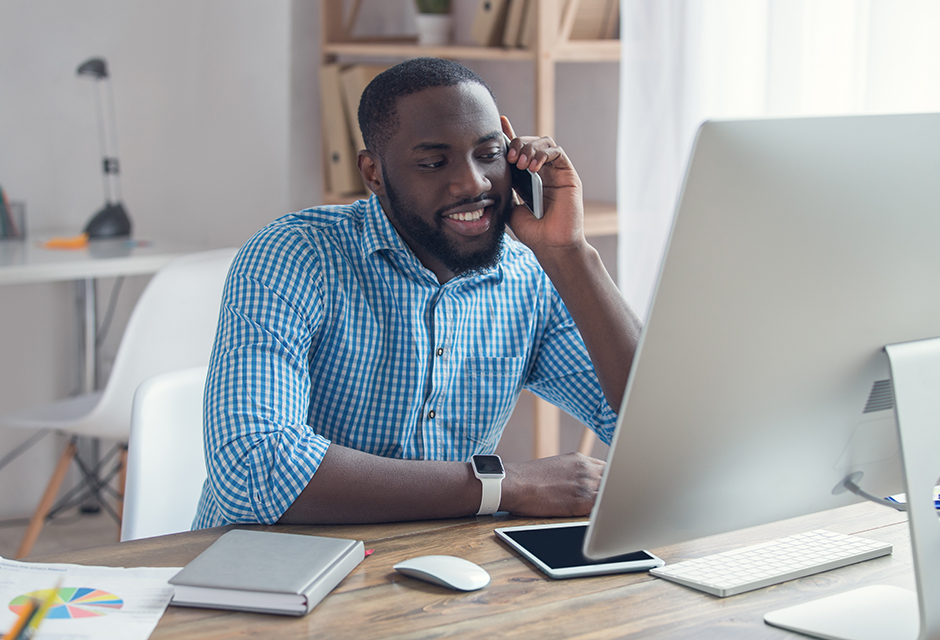 Business owner using tax workflow automation software on a laptop during busy season