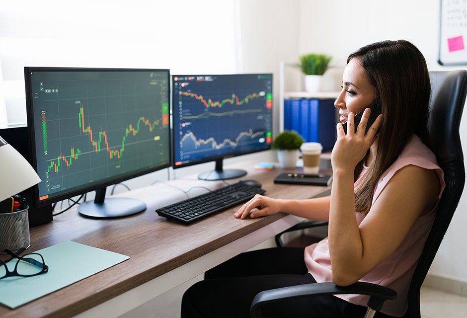 Tax professional reviewing stock transactions and market activity while preparing consolidated Form 1099-B reporting for Form 8949 and Schedule D