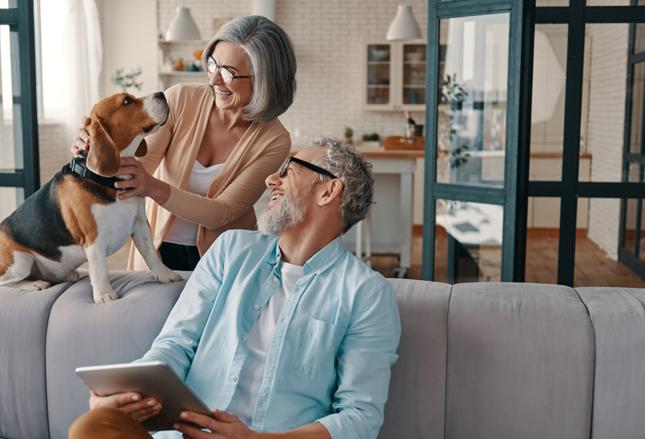 Senior couple at home, reflecting retirement tax planning issues including Social Security, Medicare, RMDs and long-term care