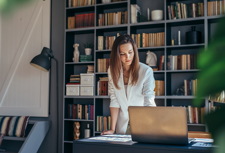 Tax professional calculating a personal casualty loss deduction for a home damaged in a federally declared disaster