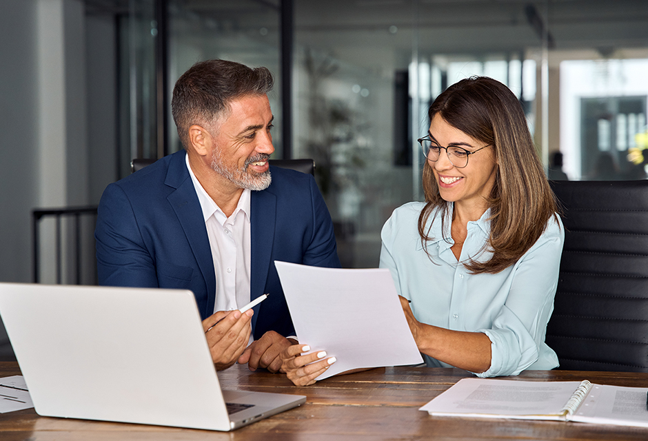 Tax professionals reviewing a post-tax-season firm checklist to improve workflow, client communication and pricing before next filing season