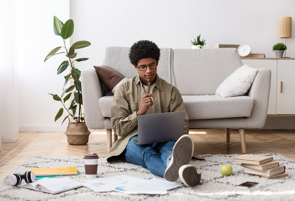 A student reviews tuition records and education tax credit information on a laptop.