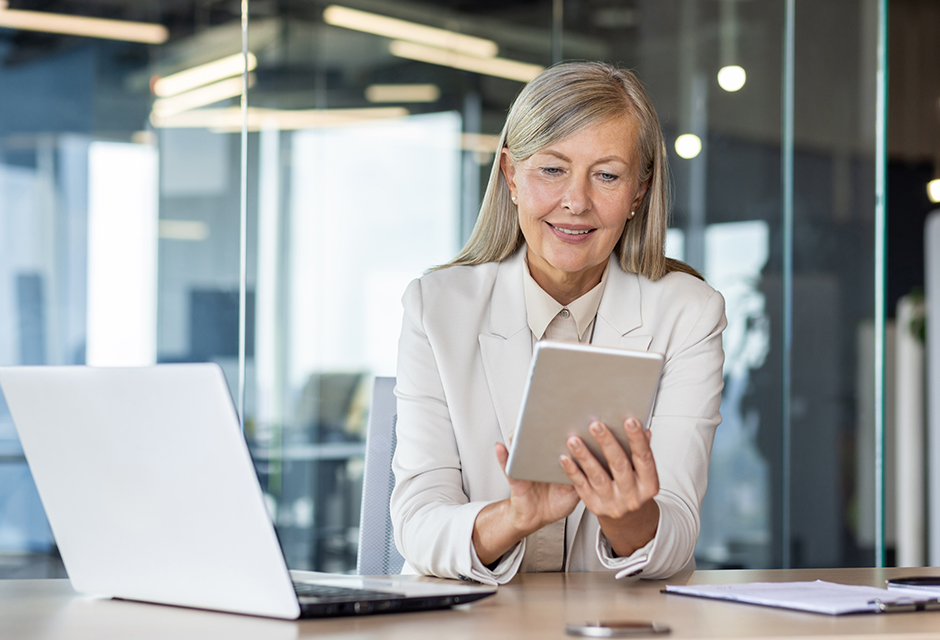 Woman reviewing earned income credit eligibility information on a laptop