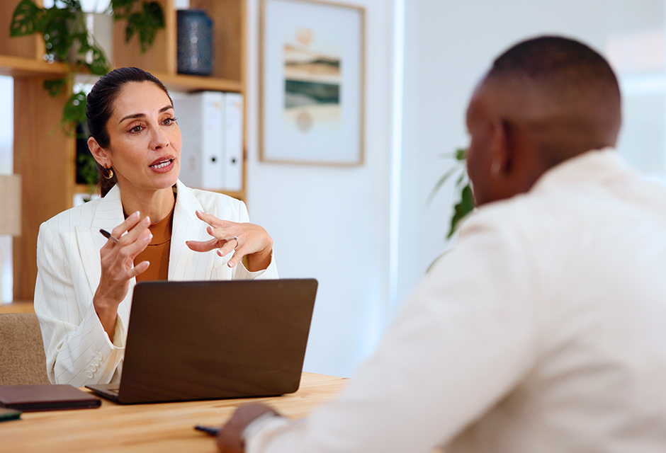 Tax professional reviewing a return error with a client and outlining amended return steps to rebuild trust and protect the relationship