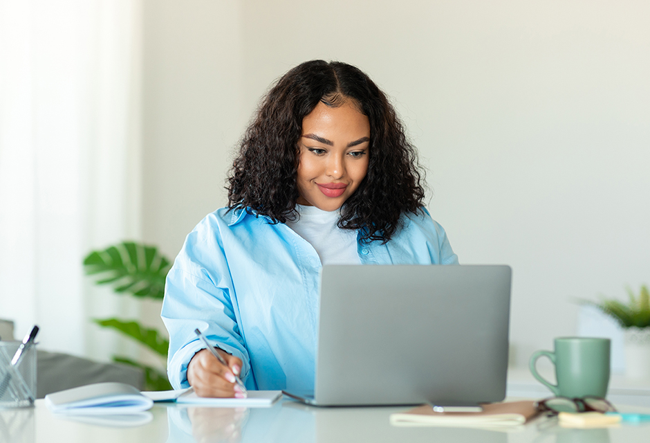 Sole proprietor working at a laptop and taking notes while reviewing SEP retirement plan contribution and deduction deadlines.