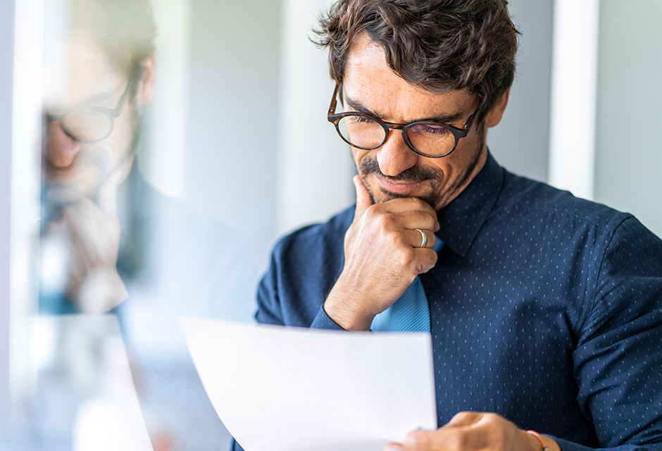 Tax professional reviewing documents while considering an IRS conservation easement settlement case