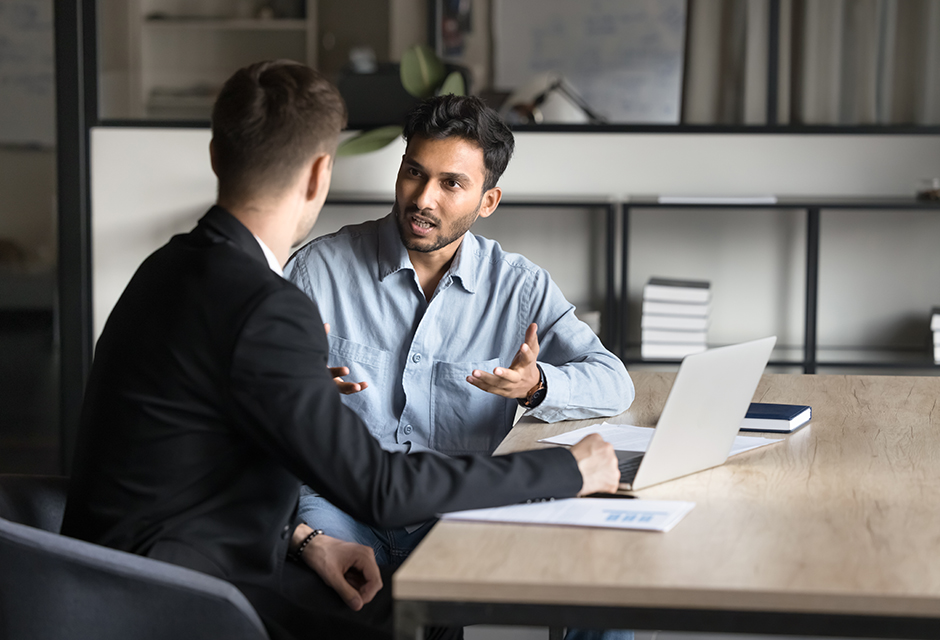 Business client reviewing tariff refund documents with a tax professional to determine federal, inventory and state tax treatment