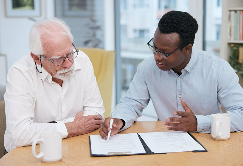 Tax professional reviewing capital gains planning documents with a client for QOZ and QSBS planning