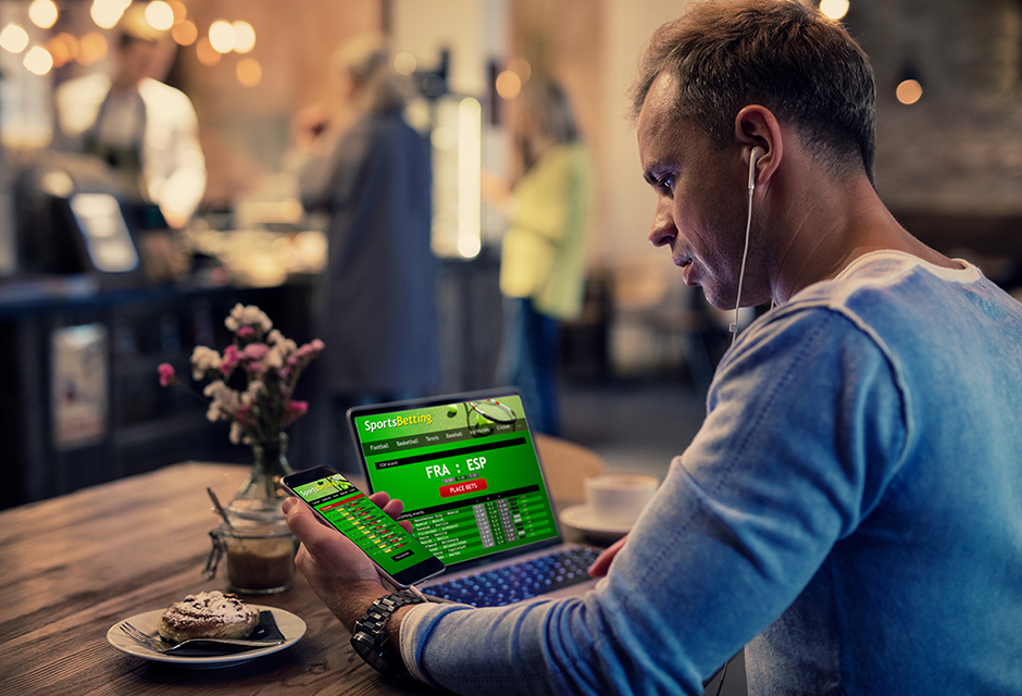 Tax professional reconciling online gambling transactions, sports betting app records and prediction platform reporting for accurate client tax return preparation