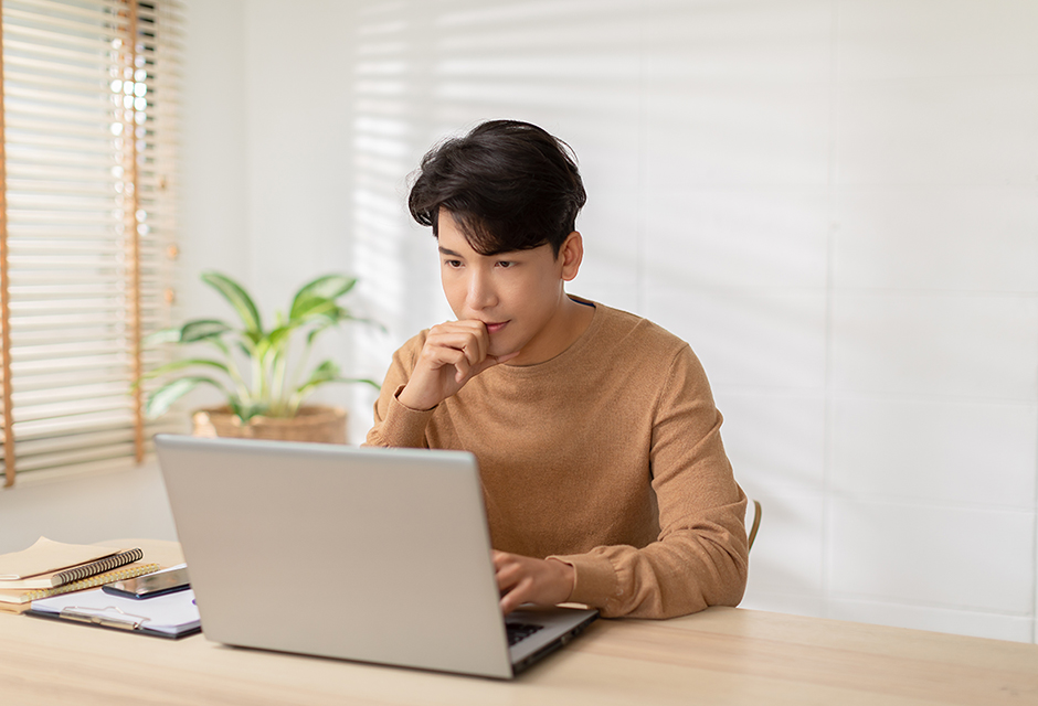A tax professional reviews IRS penalty relief rules on a laptop, highlighting the transition from first time abate to automatic exemption from penalty.