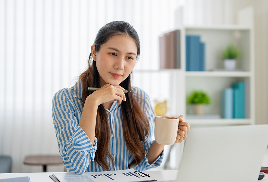 Woman reviewing financial documents at a desk, illustrating 2026 charitable deduction planning for nonitemizers.