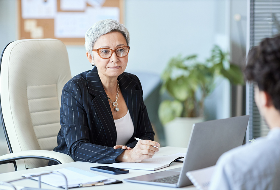 Tax professional reviewing ghost preparer red flags, PTIN compliance, and tax credit scam warning signs to protect clients and prevent improper refunds