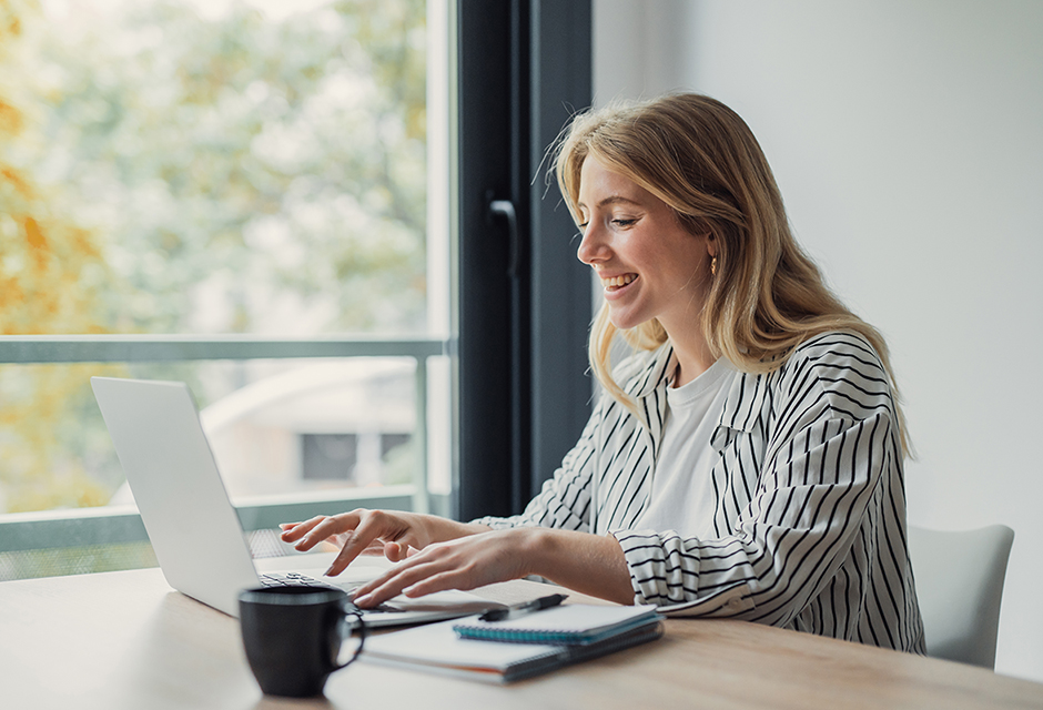 Tax professional reviewing overtime deduction rules while working on a laptop
