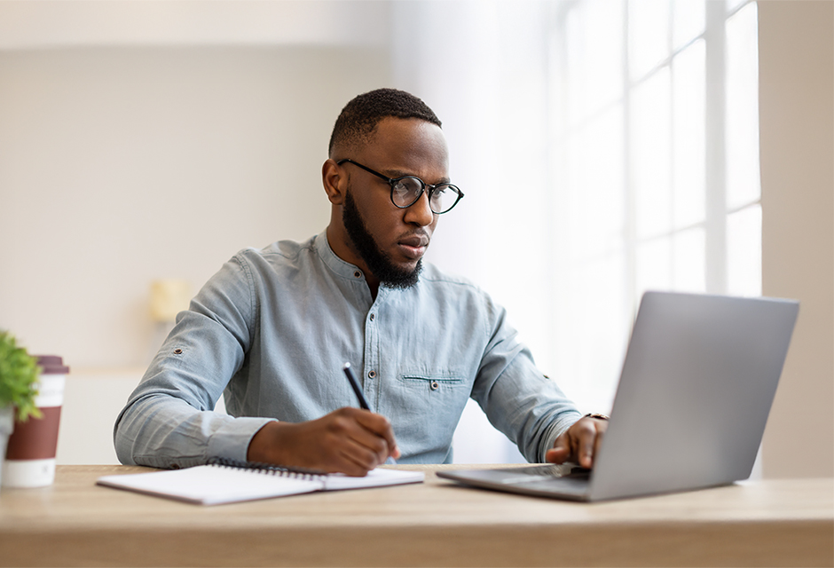 Tax professional reviewing a consolidated Form 1099 statement with multiple dividend boxes and brokerage summary pages