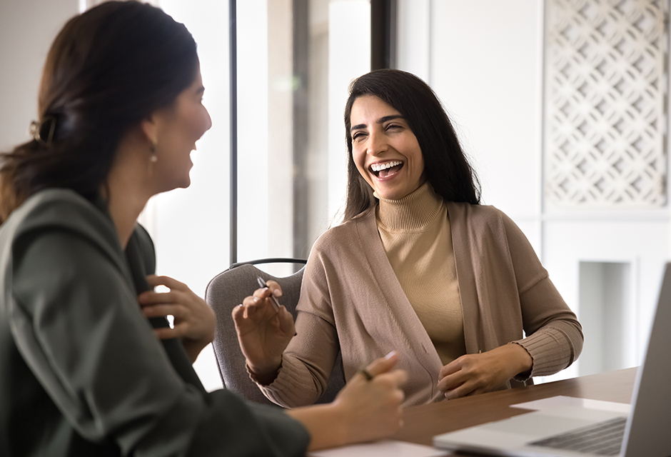 Tax professional developing proactive tax plan for clients, reviewing income documents, deductions and life changes