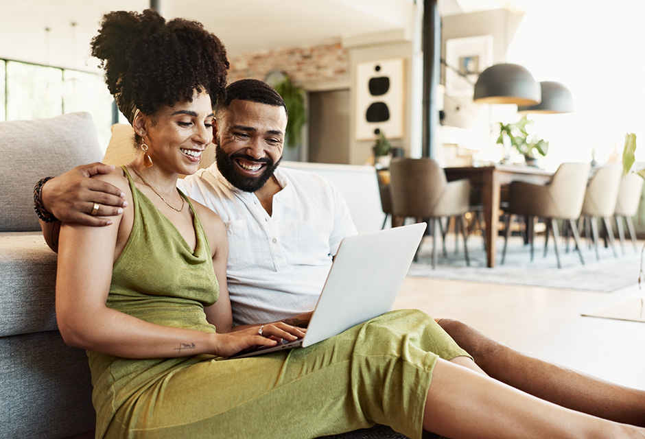 Married couple reviewing retirement savings options with a financial advisor, highlighting spousal IRA contributions and eligibility rules for nonworking spouses in 2025.