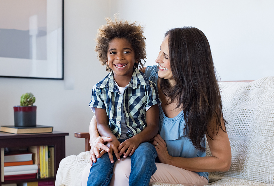 Smiling parent and child representing the 2025 adoption tax credit update, including refundable adoption credit rules and Form 8839 filing.