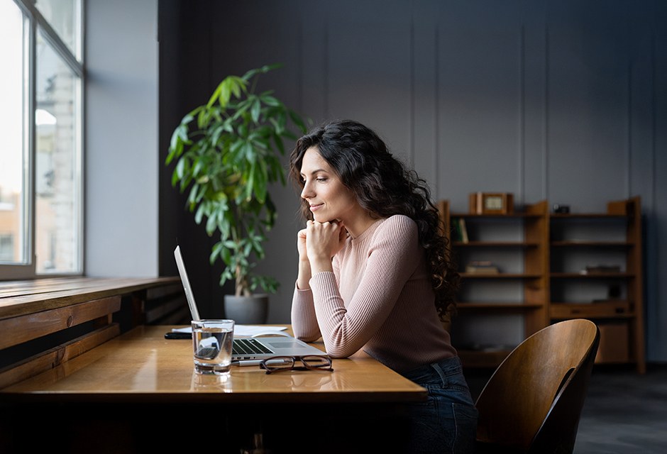 tax professional reviewing IRS transcripts on screen to interpret SFR data, masked entries and withholding details