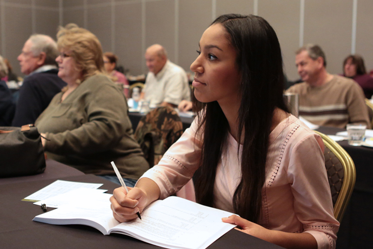 Tax professional attending virtual Tax Season Updates class, listening and learning IRS updates and tax law changes